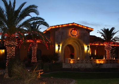 Holiday Lit Front Entrance and Palm Trees